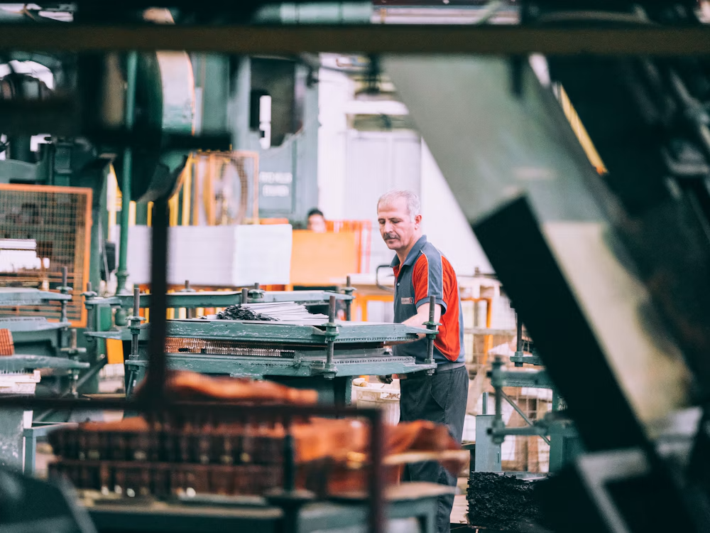 Industrial technician operating machinery